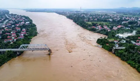 Getty Images The collapsed Phong Chau bridge over the Red River in Phu Tho province on September 9, 2024